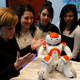 Image for article titled Why Is Angela Merkel Always Palling Around With Robots?